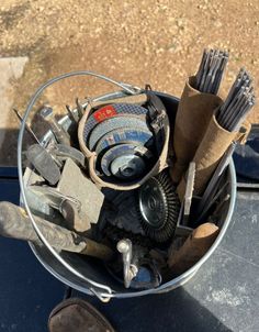 a bucket filled with lots of different types of tools