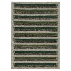 an area rug with green and grey stripes on the bottom, in front of a white background