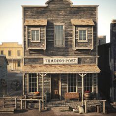 an old wooden building with the words trading post written on it