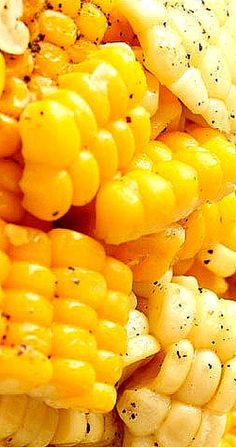 closeup of corn on the cob with seasoning sprinkled on it