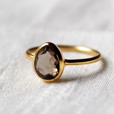 D E T A I L S - Material: 92.5 sterling silver Stone: Smoky Quartz The fit: true to US ring size Finish: smooth and Gold Plated to a high shine S H I P P I N G & P R O D U C T I O N - My current production time is 2-6 business days, which means after those days are up, your order ships! I make everything custom to order, by hand, but I promise you it's worth the wait! R U S H - M Y - O R D E R - If you're in a rush to get your pretty new pieces, please send me a message and I'll let you know Smokey Quartz Ring, Wedding Day Jewelry, Smoky Quartz Ring, Brown Gemstone, Chalcedony Ring, Onyx Ring, Quartz Ring, Smokey Quartz, Dainty Ring