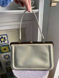 Beige cream leather 50s/60s handbag by Waldybag. With tortoishel frame  Very good vintage condition. A couple of small areas of discolouration on corners. Shown in pics.  11x9x3.5" ex handles Elegant Top Handle Bag With Lined Interior, Vintage Beige Handheld Shoulder Bag, Vintage Beige Satchel, Vintage Cream Shoulder Bag, Vintage Beige Satchel With Handles, Vintage Beige Shoulder Bag With Handles, Vintage Cream Bags With Detachable Handle, Vintage Beige Satchel With Top Carry Handle, Vintage Cream Satchel For Travel