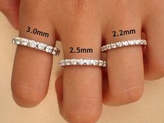 the size and width of two rings on someone's hand with measurements for each ring