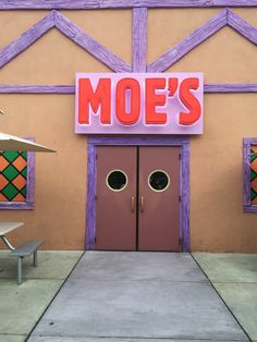 there is a sign that says mof's on the side of a building