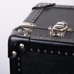 This Black EPI Leather suitcase is the perfect companion for your travel adventures. Featuring a classic trunk style that incorporates the previous original luggage designs of Louis Vuitton. With a spacious interior and an extremely sturdy exterior, you can that your items are going to be kept safely. Louis Vuitton has ensured security with this design, it comes with a 3 fastenings systems, 2 buckles and a lock with 2 spare keys. The all black leather exterior is chic and classy whilst the silver toned studs and rivets add a luxurious extra touch. SPL?ÿ Exterior Noir Epi leather Lock with spare keys and two complimentary trunk latches Leather Trim Silver toned brass rivets and studs Top handles Very good condition, one scratch on the front of the suitcase Date Code AAS46365 Interior Canvas Japanese School Bag, Black Suitcase, Leather Trunk, Leather Suitcase, Luggage Straps, Japanese School, Dior Shoes, Diaper Backpack, School Bag