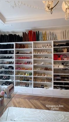 the closet is filled with many pairs of shoes