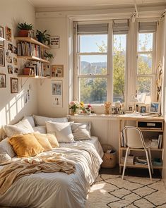 a bed sitting in a bedroom next to a window with lots of pictures on the wall