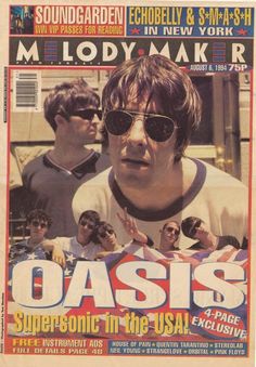 a magazine cover with an image of the band oasis on it's front page