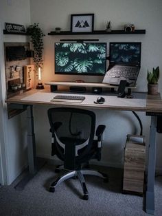 a computer desk with two monitors and a laptop