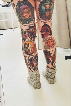 a woman's legs with tattoos on them