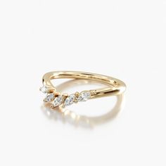 a gold ring with three diamonds on it