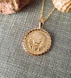 14K Solid Gold Lion  Necklace with Twisted Frame. It's Handmade From a Small Workshop in Greece. Available Only in Yellow Gold. Can be Made in White Gold or Rose Gold by Order (I Recommend this Item Only in Yellow Color). The Size of the Photo Item is 16mm Without bail / 0.63 Inches and The Chain is 45cm / 17.7 Inches.   Every Jewel is in Gift Box. Quick Delivery via DHL.  ★ If you have any additional questions about this item message us and we will get back to you within a few hours. Visit here Yellow Gold Zodiac Sign Medallion Necklace, Lion Jewellery, Lioness Necklace, Lion Pendant Men, Lion Pendant Gold, Lion Charm, Lion Necklace, Gold Lion, Lion Pendant