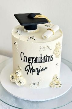 a graduation cake with congratulations written on it