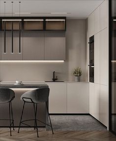 an image of a modern kitchen setting with bar stools in the center and countertop