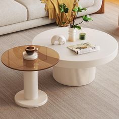 a white coffee table sitting on top of a living room floor next to a couch