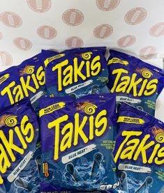 five bags of taks are sitting on a table