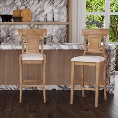 two wooden chairs sitting in front of a marble counter