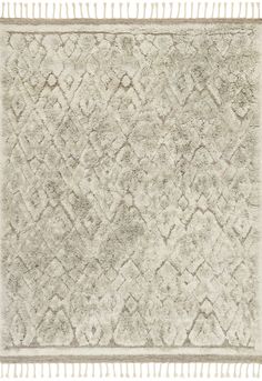 a white rug with fringes on the edges and an area rug that is made out of