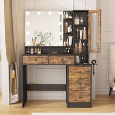 a dressing table with drawers, mirror and lights on the top shelf in front of it