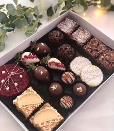 a box filled with lots of different types of chocolates