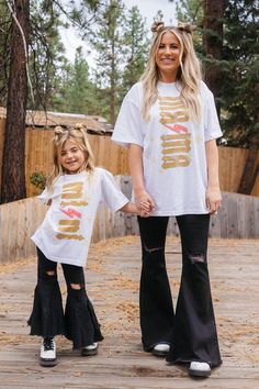 MAMA star & lightning graphic t-shirt. This mama graphic tee runs big, Krista is wearing a size Large. Pairs perfectly with our MINI stars & lightning t-shirt for the coolest matching mother daughter outfit! Shop the full Krista Horton x Slyfox collection for more trendy mom shirts, matching mom and daughter shirts & everything you need to achieve the ultimate cool mom aesthetic. Young Mom Outfits, Mom And Daughter Shirts, Young Mom Style, Acdc Tee, Krista Horton, Aesthetic Kids, Kid Aesthetic