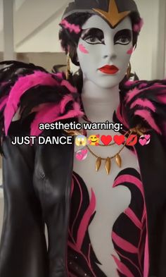 a mannequin with pink and black feathers on it's head wearing a costume