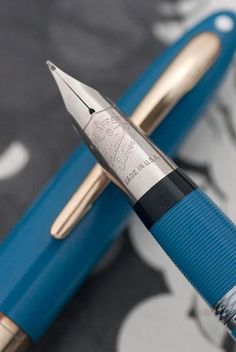 a fountain pen sitting on top of a table