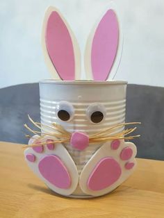 a tin can with some bunny ears sticking out of it's sides and eyes