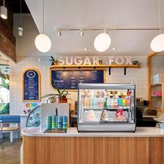 the inside of a sugar fox ice cream shop