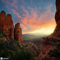 the sun is setting over some rocks in the mountains near sedona, arizona