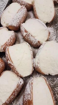 powdered sugar covered pastries in a pan