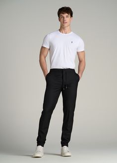 Men's Tall Pants: A Fusion of Elegance Where Comfort Meets Class Introducing our Jogger Dress Pants – a modern twist on classic suit pants for tall men. These pants blend the sophistication of traditional suit trousers for tall men with the comfort of joggers, making them perfect for both office and casual wear. The ankle-length cut and modern fit provide a sleek, contemporary look, while the slash and double welt pockets add functionality and style. Experience a new kind of elegance with these Black Trousers Outfit Men Casual, Black Pants Men Outfit, Black Joggers Outfit Men, Black Trousers Outfit Man, Casual Black Outfits, Black Pants Outfit Men, Tailored Pants Outfit, Black Joggers Outfit, Black Trousers Outfit