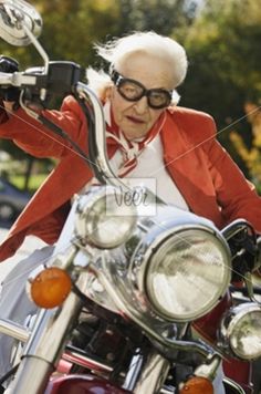 an older woman riding on the back of a motorcycle with text that reads, let's ride