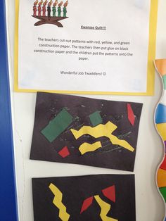 a bulletin board with paper cut out of different shapes and colors on it's side