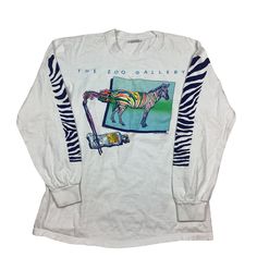 Vintage 1983 The Zoo Gallery Long Sleeve Stand Out From The Herd Zebra single, stitch T-shirt. Made in the USA. Double sided graphic. Measures as an XS/XXS. 17 inches pit to pit, 24 inches long. Excellent vintage condition. Smoke and pet free home. 80s single stitch T-shirt. USA made. 90s Graphic Print Long Sleeve T-shirt, Vintage Long-sleeve Graphic Print T-shirt, 90s Long Sleeve Graphic T-shirt, Vintage Long Sleeve Tops With Graphic Design, Vintage Long Sleeve Graphic Tops, 90s Style White Tops With Vintage Print, 90s Long Sleeve Pre-shrunk Tops, 90s Style Long Sleeve Pre-shrunk Top, Stand Out