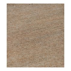 a close up view of the texture of an area rug in brown and beige tones