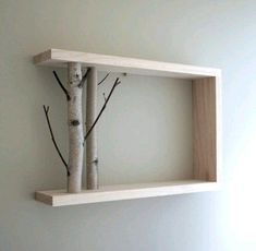 two wooden shelves with branches on them