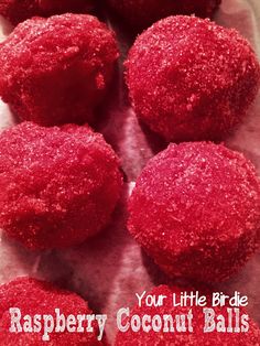 raspberry coconut balls on a plate with the words, your little birdie raspberry coconut balls