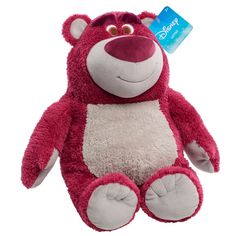 a red and white teddy bear with a tag on it's ear, sitting in front of a white background