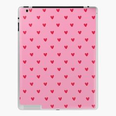 a pink ipad case with red hearts on it