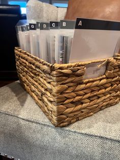 a wicker basket with cd's in it