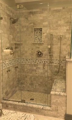 a walk in shower sitting inside of a bathroom