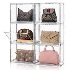 four clear acrylic cubes with purses in each one on the bottom