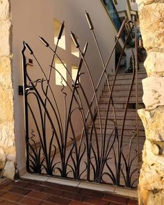 an iron gate on the side of a building