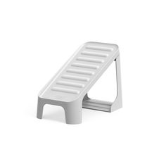 a white step stool on a white background