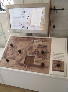 a display case with buttons and pictures on it