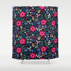 a shower curtain with colorful flowers and leaves on it, against a black background that has white stars in the middle