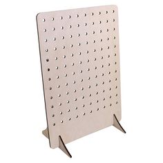 a metal peg board with holes on the front and bottom, standing upright against a white background