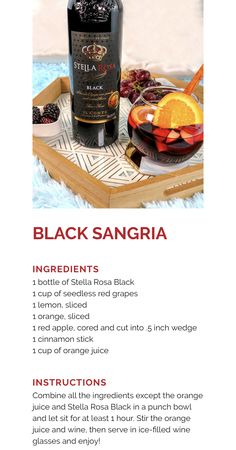 a bottle of black sangria on top of a wooden tray with orange slices and fruit