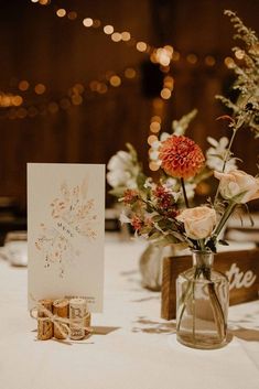 a table with flowers and cards on it